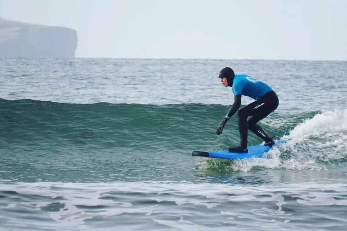a man riding a wave on a surfboard in the ocean