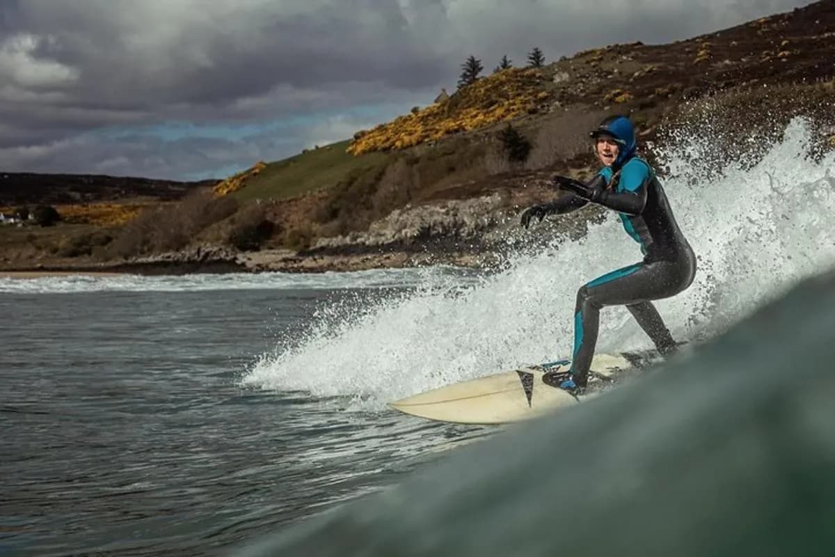 a man riding a wave on a surfboard in the water