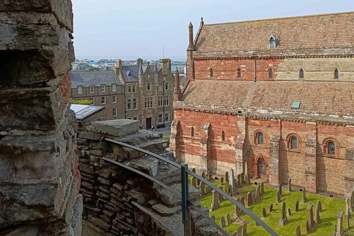 a view of an old brick building with a cemetery