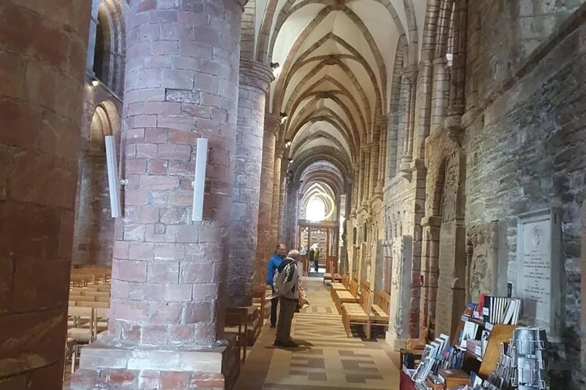 a group of people standing inside of a cathedral