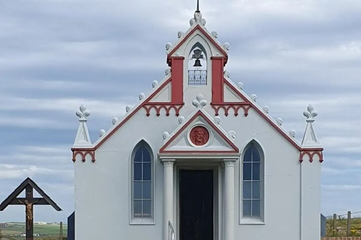 a white church with a red and white steeple