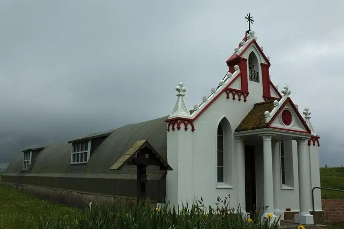 a small white church with a black roof