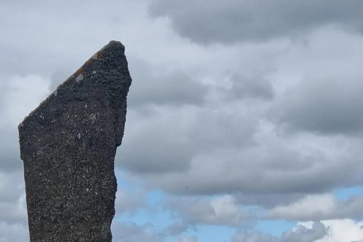 a large rock sticking up into the sky