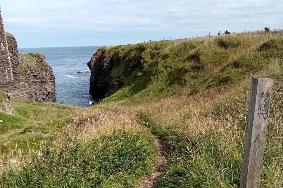 a path leading to a cave in the ocean