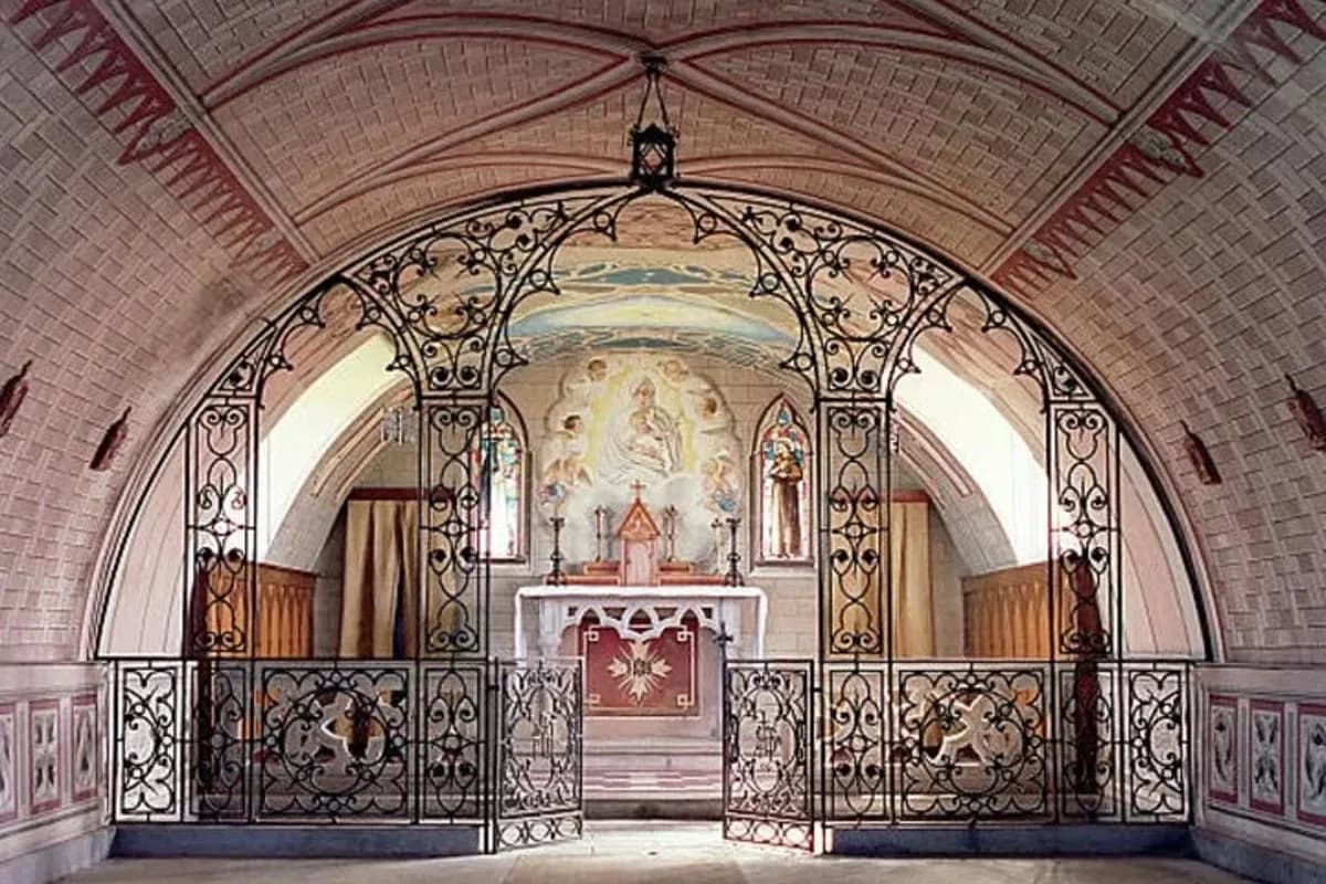 an ornate gate to a church with a altar
