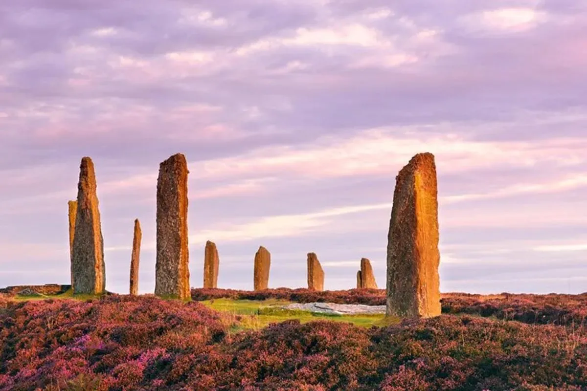 a group of stone towers in a field